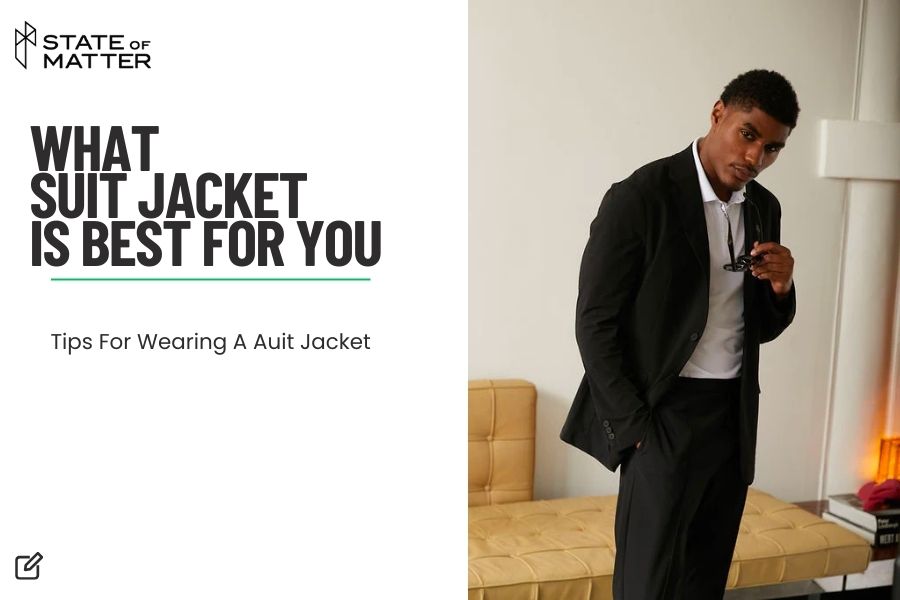 Featured image for blog post: "WHAT SUIT JACKET IS BEST FOR YOU - Tips For Wearing A Suit Jacket" by State of Matter, showing a man adjusting a black suit jacket, looking thoughtfully at the camera in a well-lit room with a minimalist aesthetic.