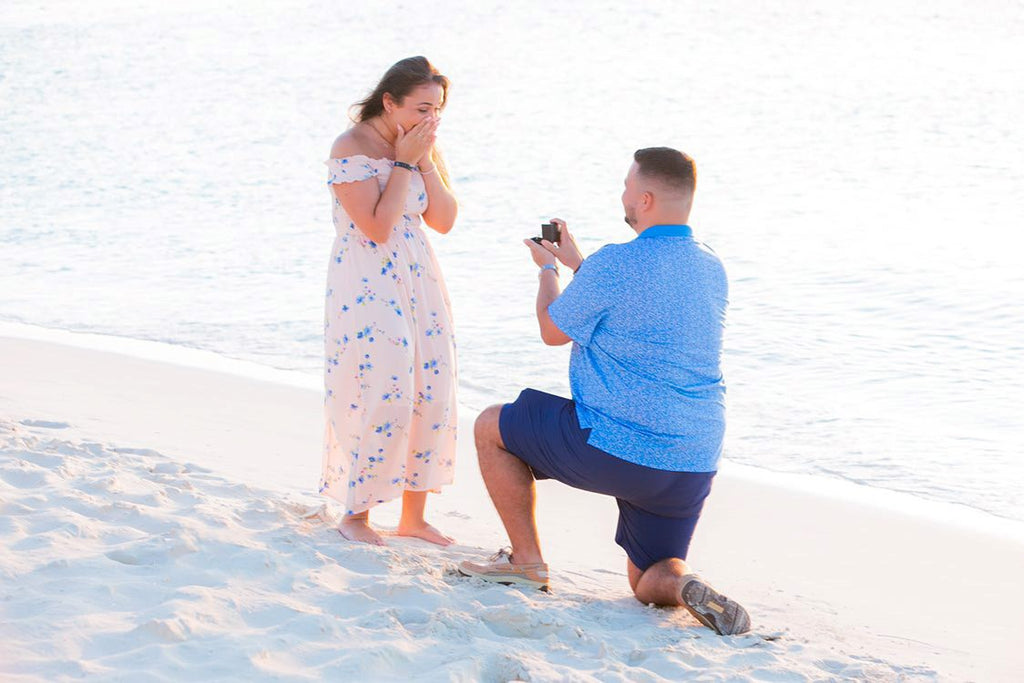 Man proposing on the beach wearing State of matter apparel