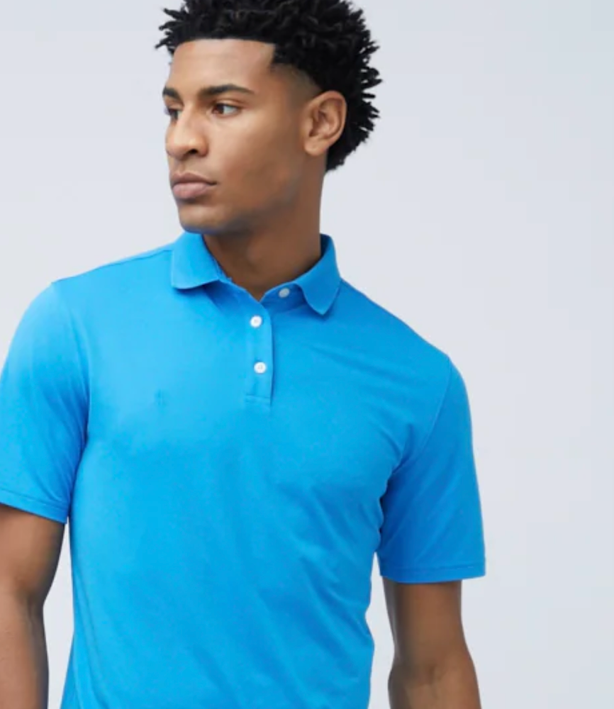 A man wearing a State of Matter Sustainable Turquoise Men's Polo Shirt