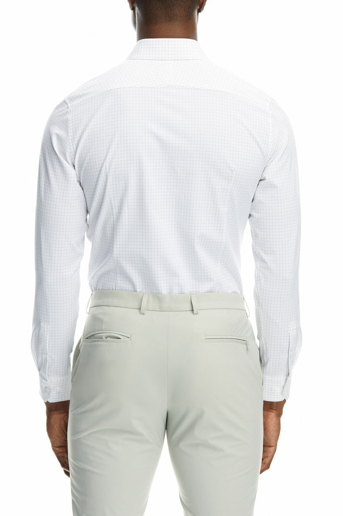 Back picture of a man wearing State of matter sustainable long sleeve grey checkered button down shirt and gray chino pants