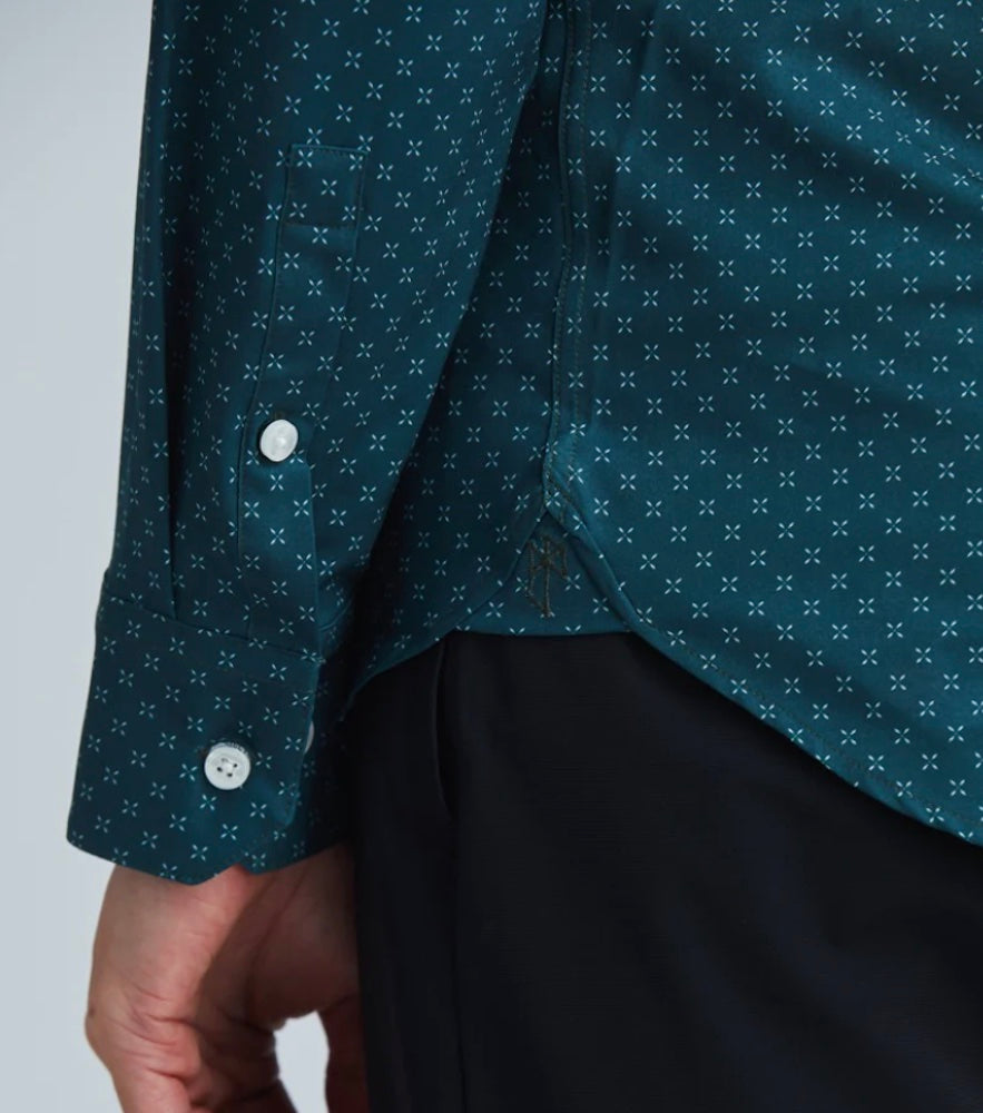 A close up on the sleeve of a State of Matter's Sustainable Geo Print Forest Green Long Sleeve Men's Dress Shirt.