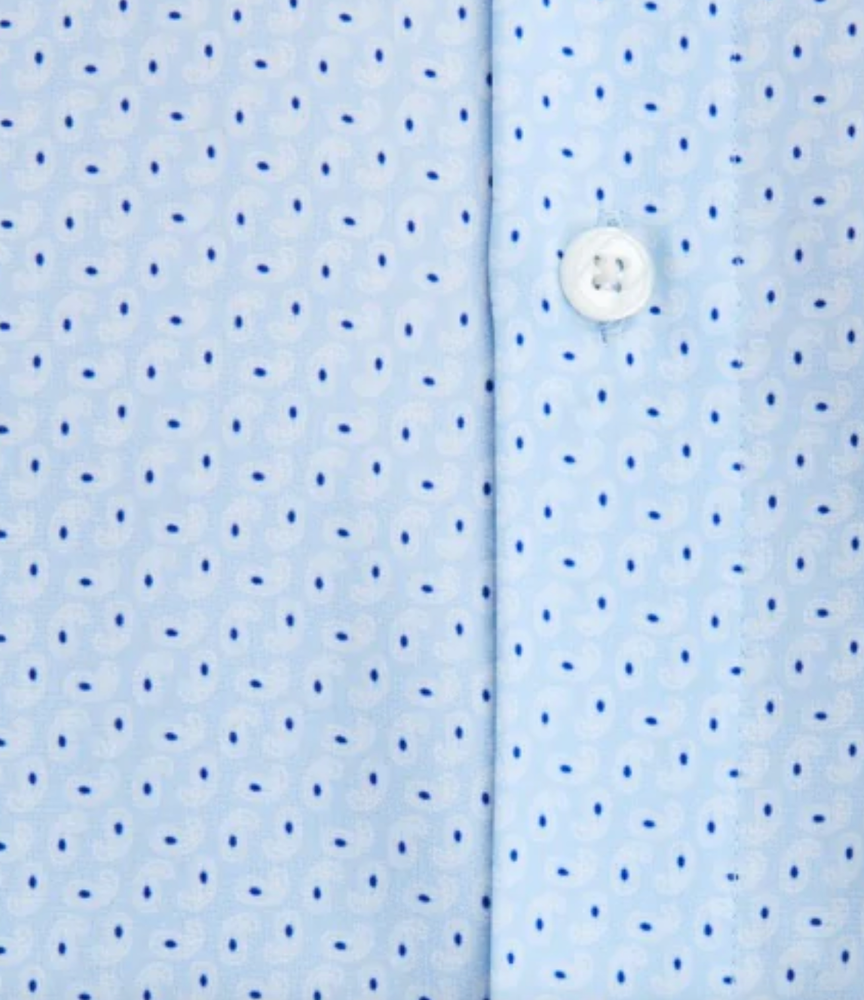 A close up of the State of Matter's sustainable blue paisley button up shirt. 