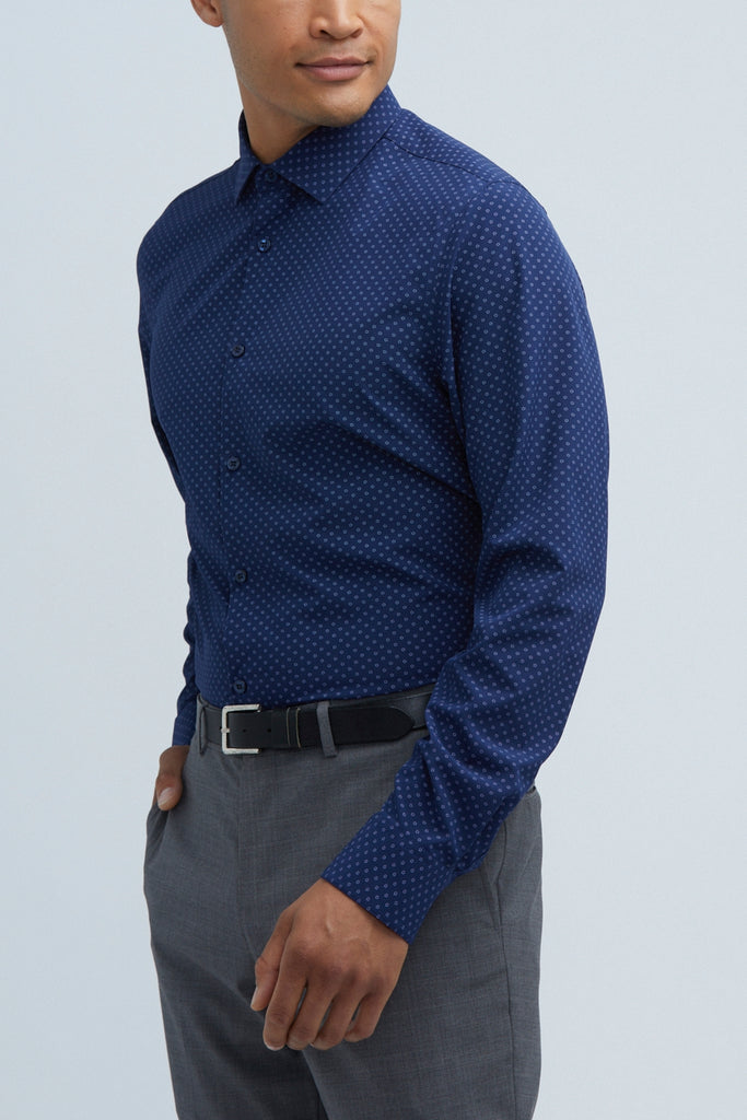 Man posing in his state of matter Navy blue button up shirt and gray chino pants