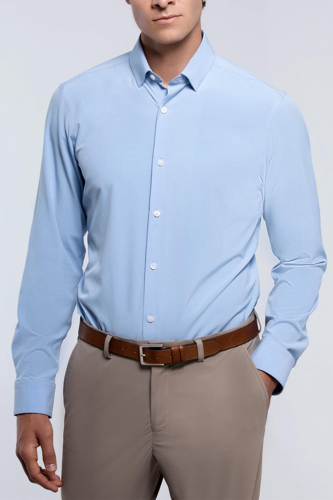 Front view of a man wearing state of matter sustainable men's long sleeve light blue shirt and khaki chino pants